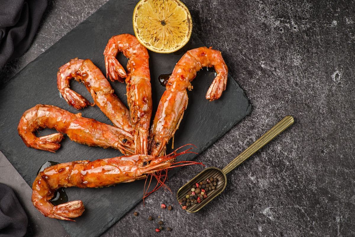 langoustines with lemon on a blackboard